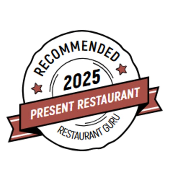 A "Recommended 2025 Present Restaurant by Restaurant Guru" badge with stars and a ribbon.